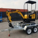 Mini-escavadora com reboque de transporte